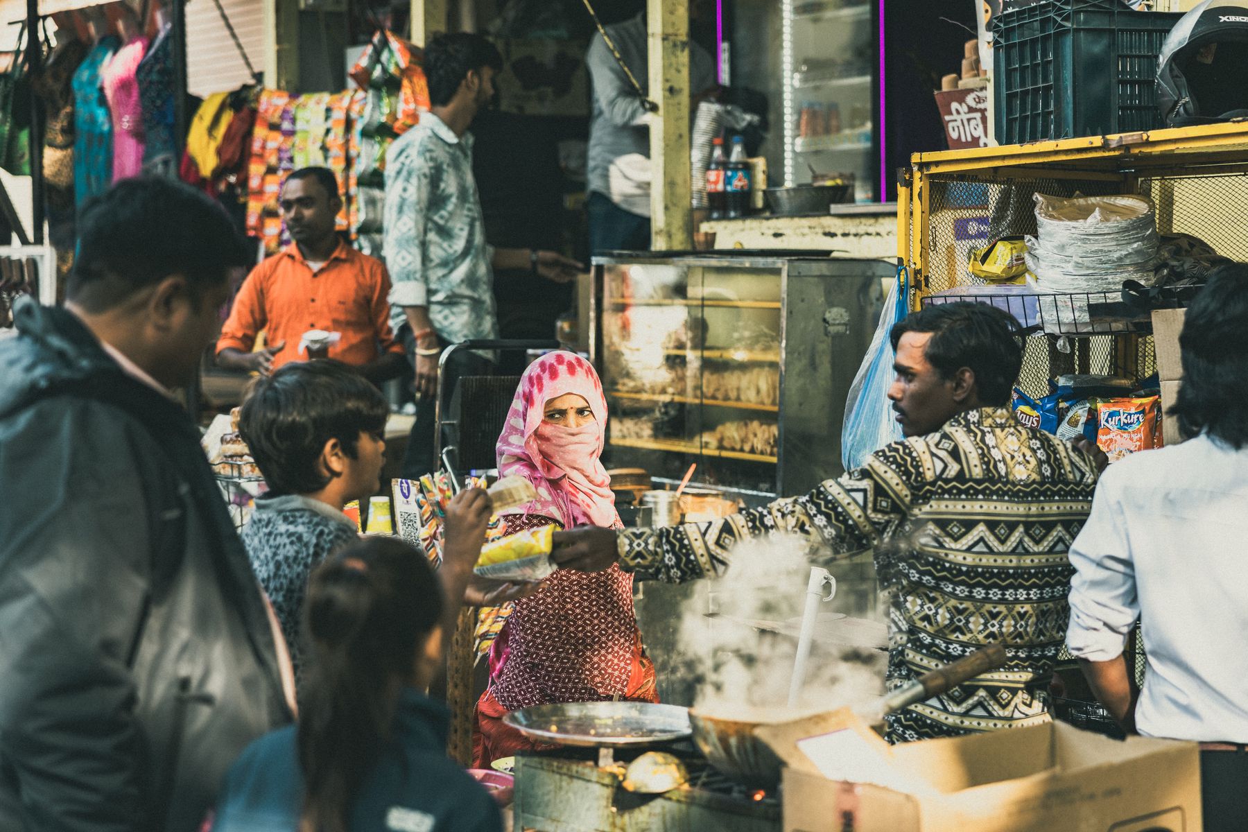 Crowded Market Food Stall With Steam